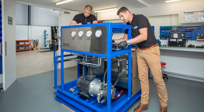 Two of Zeus Hydratech's Hydraulic engineers making some final touches to a bespoke hydraulic power pack.