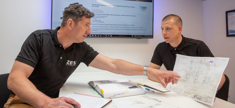 Two of Zeus Hydratech's Hydraulic Engineers reviewing specifications for a Hydraulic project.