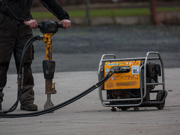 A mobile surface breaker, powered by a mobile hydraulic power pack.