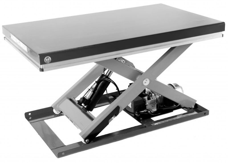 A common use for compact power packs is in lifting equipment, such as the scissor lift table in this image.